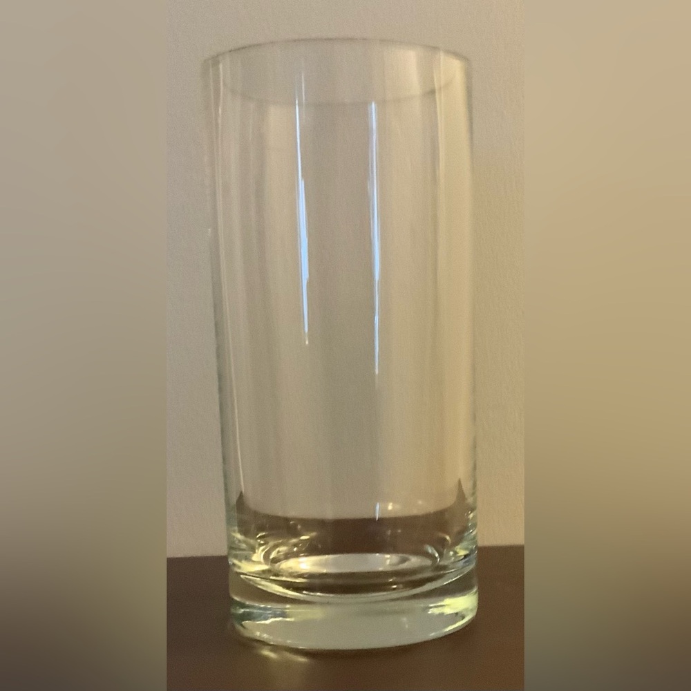 Tall round clear glass vase